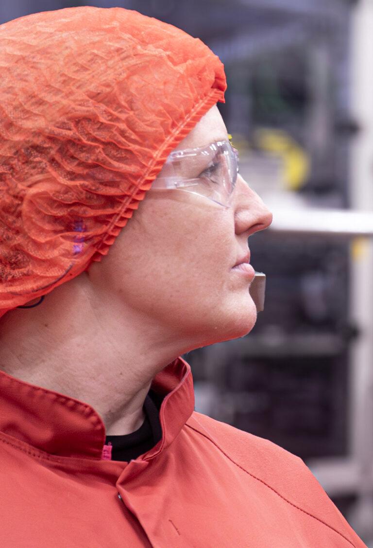 woman-wearing-red-protective-gear-close-up